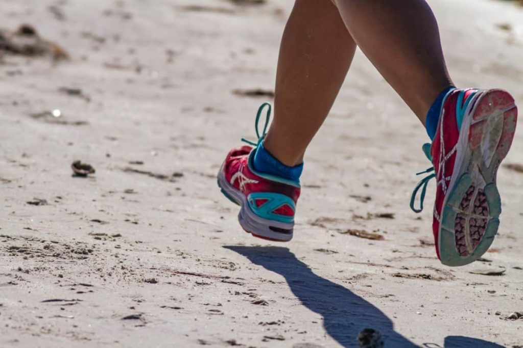 woman-running-sneakers-sand